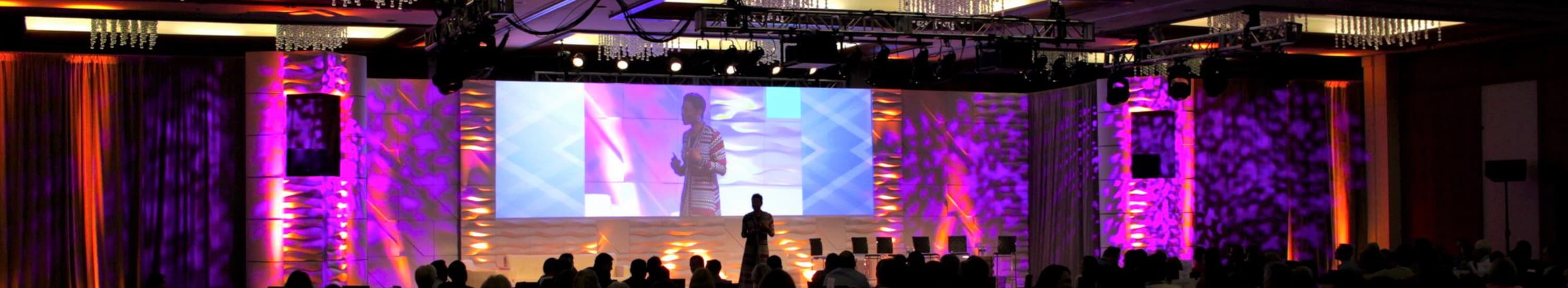 Theresa M Robinson Keynote Speaker Banner Theresa M Robinson on large stage at a massive event